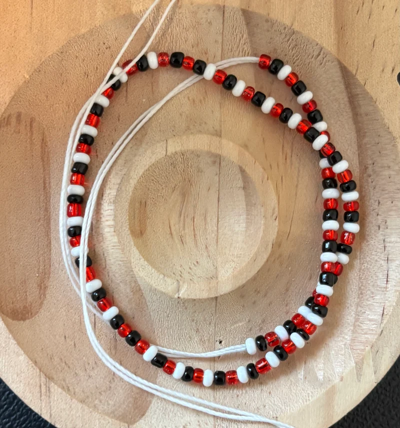 Red black and white tie on anklet 10 in half inches