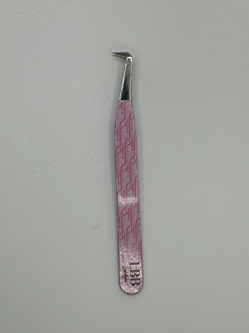 Dior pink tweezers