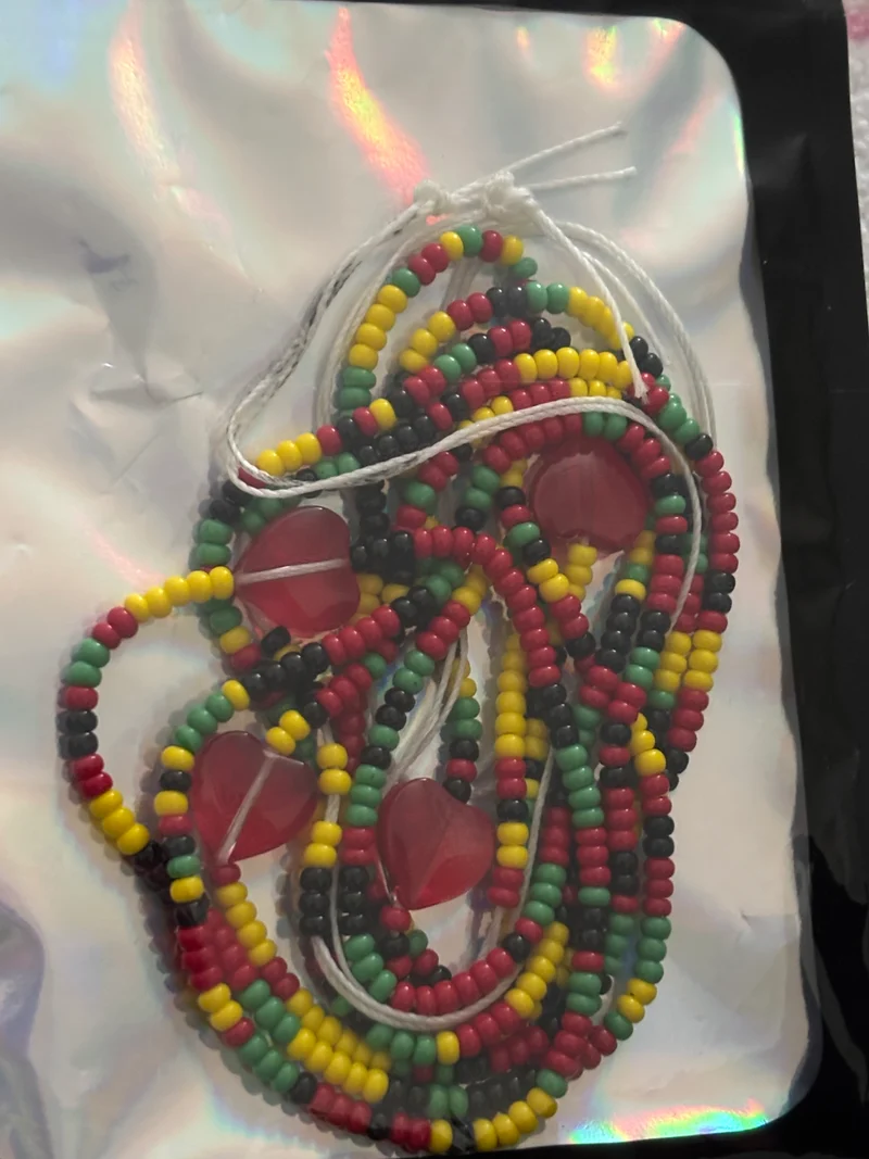 Juneteenth/black history 50 inch tie on waist bead with red hearts on it