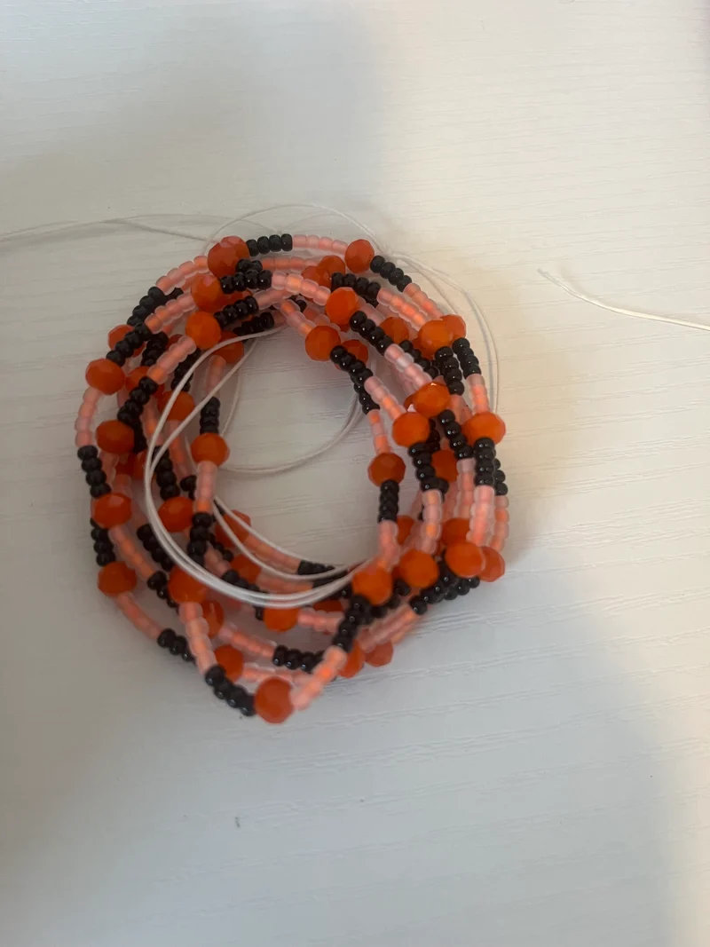 Orange and black 50 inch tie on waist bead