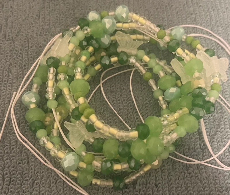 Green waist bead with glow in the dark butterflies 50 inches long tie on