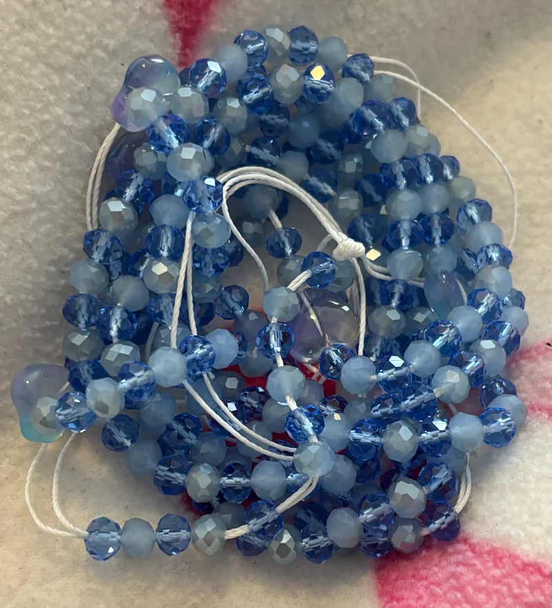 Different shades of blue waist bead with blue hearts 50 inch tie on