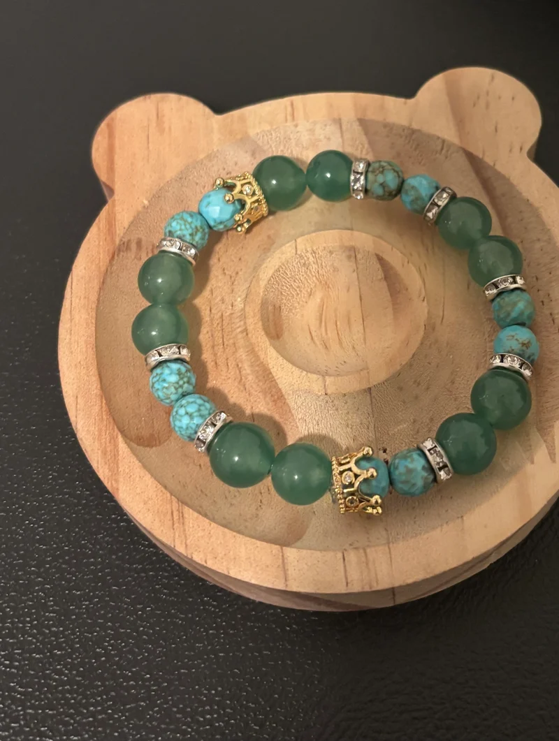 Green adventuring and turquoise bracelet with a crown